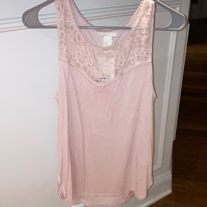 A pink tank top with design